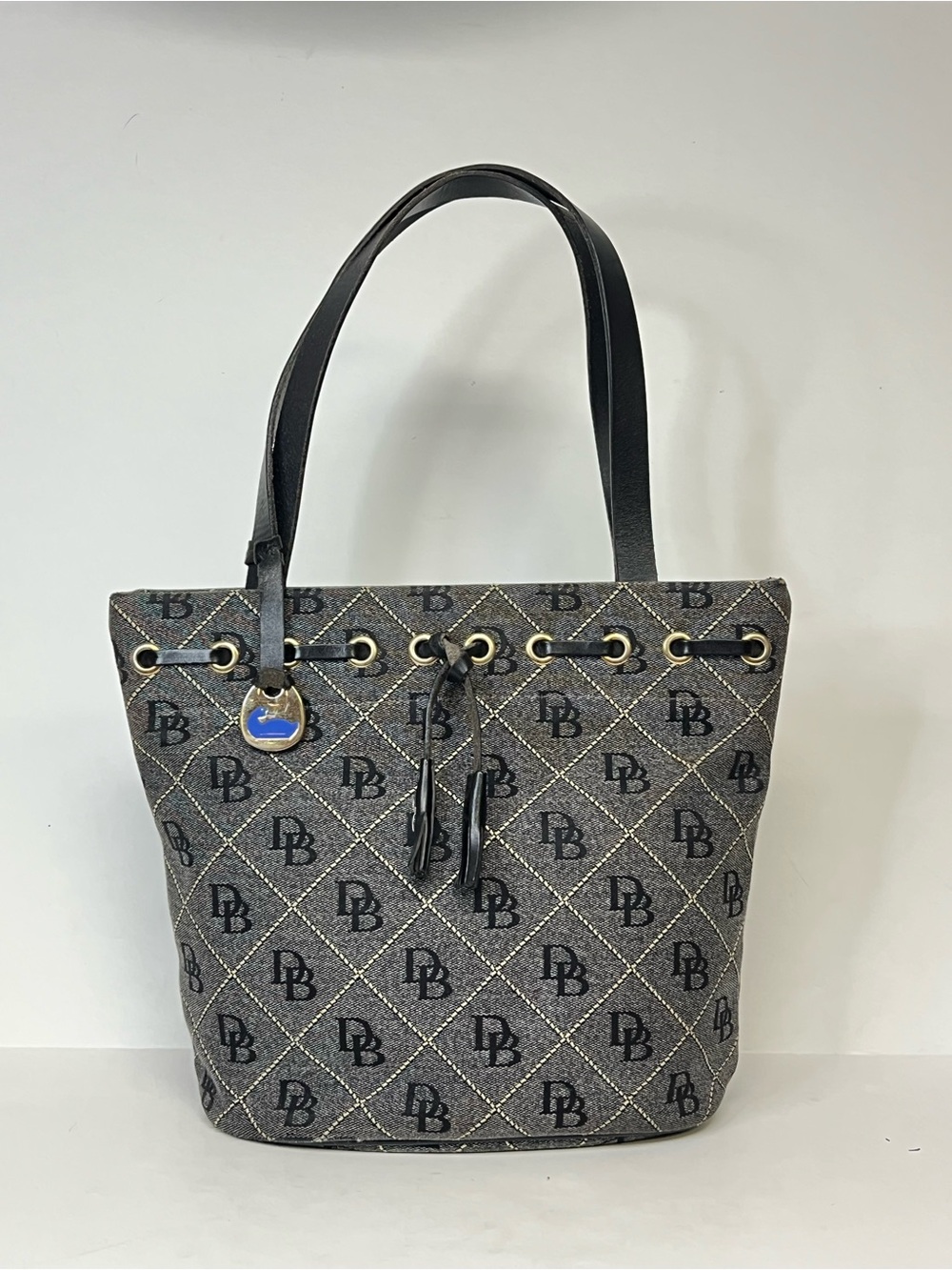 Dooney & Bourke Signature Monogram Tassel Bucket Bag Purse Tote